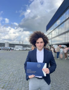 With KTU bachelor's degree diploma in Kaunas